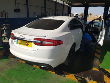 Jaguar XF on weighscale beginning ITV import test White Jaguar XF Coupe